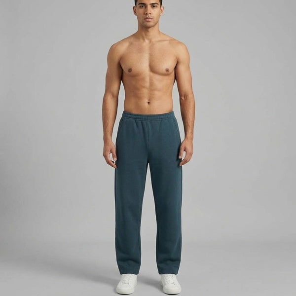 Dark teal unisex barrel leg sweatpants with a relaxed fit, full-length front view on a model.