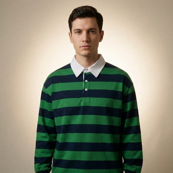 Green and navy striped long-sleeve polo shirt with a loose fit, three-quarter front view on a model.