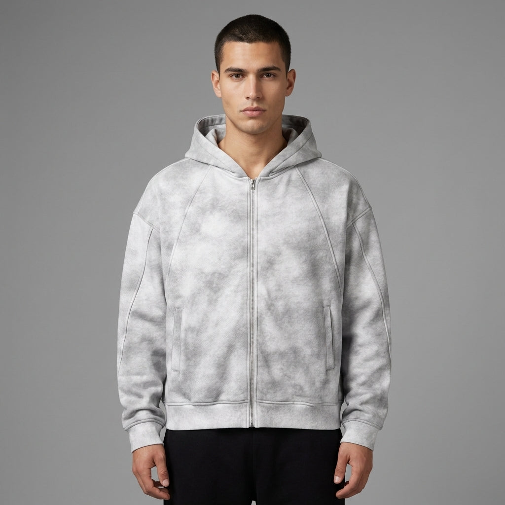 Light gray dirty-washed zip-up fleece hoodie with front pockets and ribbed cuffs, front view on a model.