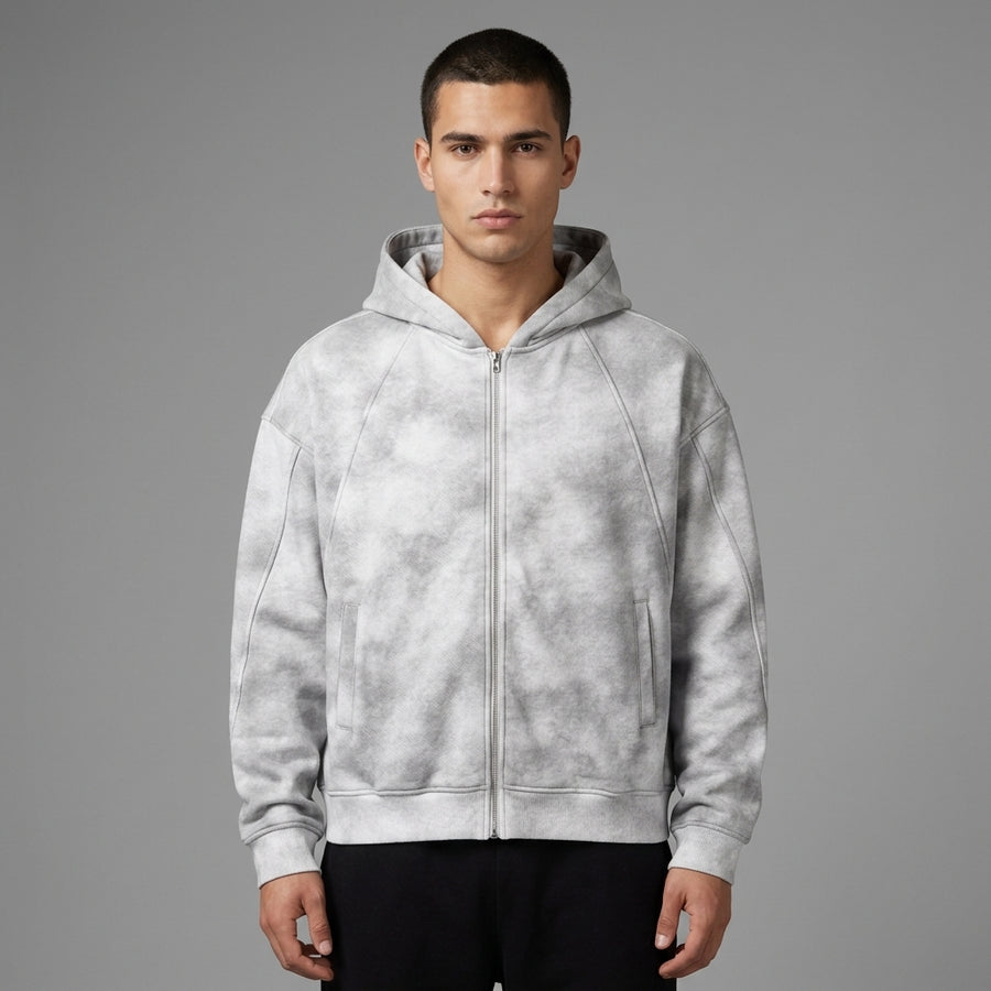 Light gray dirty-washed zip-up fleece hoodie with front pockets and ribbed cuffs, front view on a model.