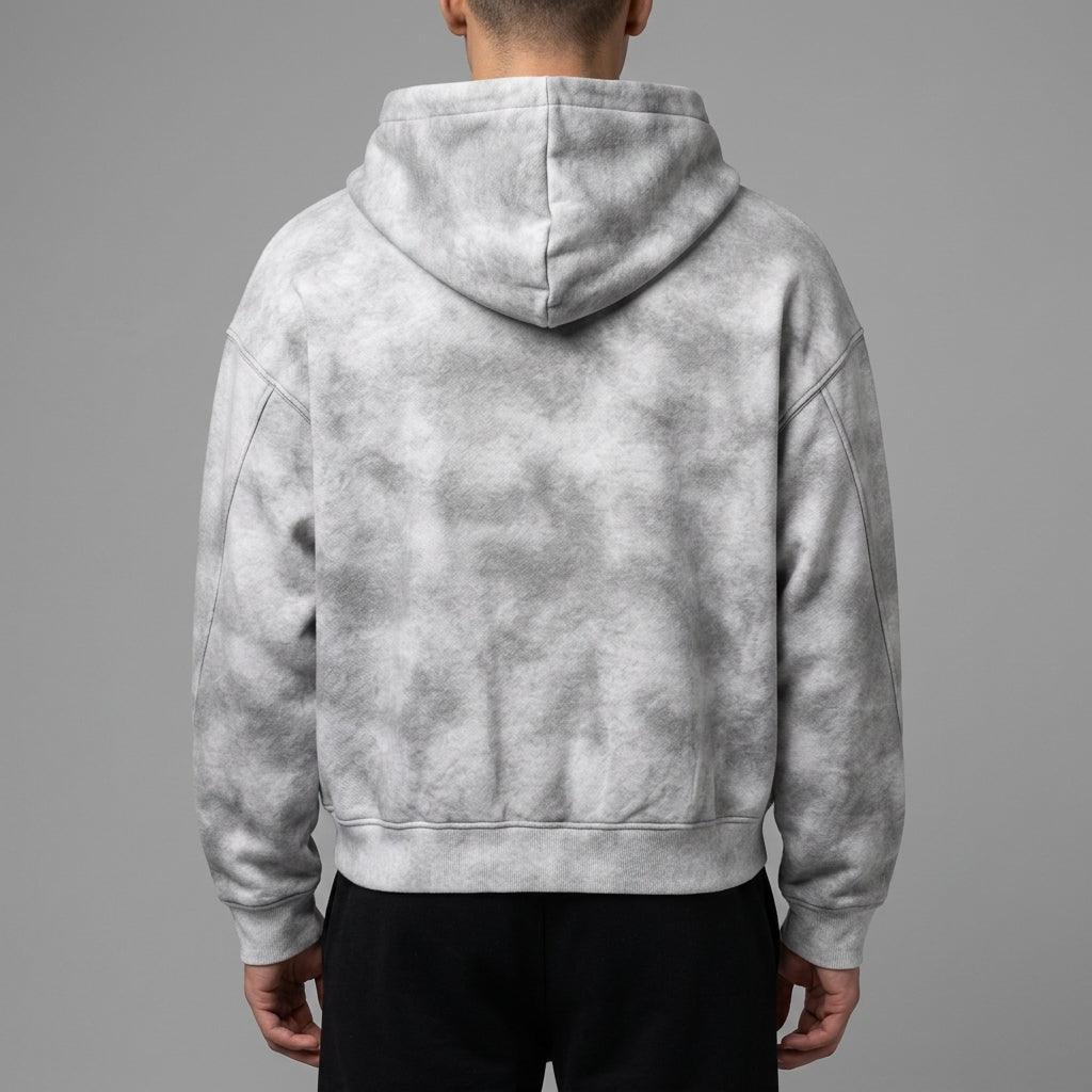 Back of the light gray dirty-washed zip-up fleece hoodie showing the hood and ribbed hem.