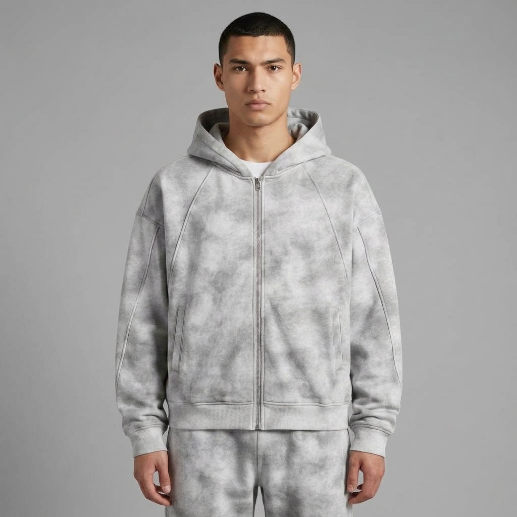 Light gray dirty-washed zip-up fleece hoodie styled with matching washed sweatpants.