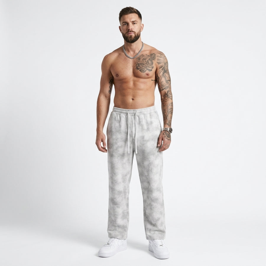 Light gray dirty-washed fleece sweatpants with an adjustable drawstring waist and loose legs, front view.