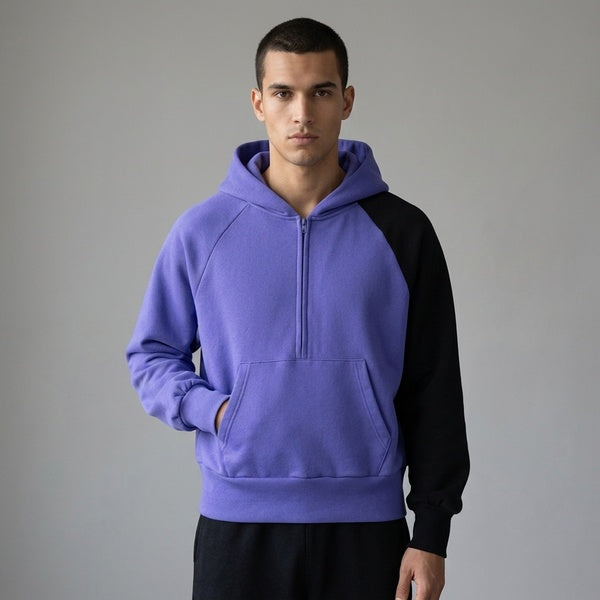 Purple and black Unisex Color-Block Fleece Hoodie in an angled front view with a kangaroo pocket.