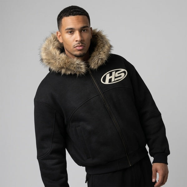 Black Sun Fade Boxy Detachable Fur Hoodie on a model in an angled front view, showing the fur trim and zipper.
