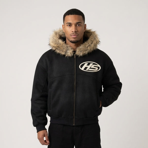 Black Sun Fade Boxy Detachable Fur Hoodie on a model, showing the fur-trimmed hood, full zip and HS chest logo.