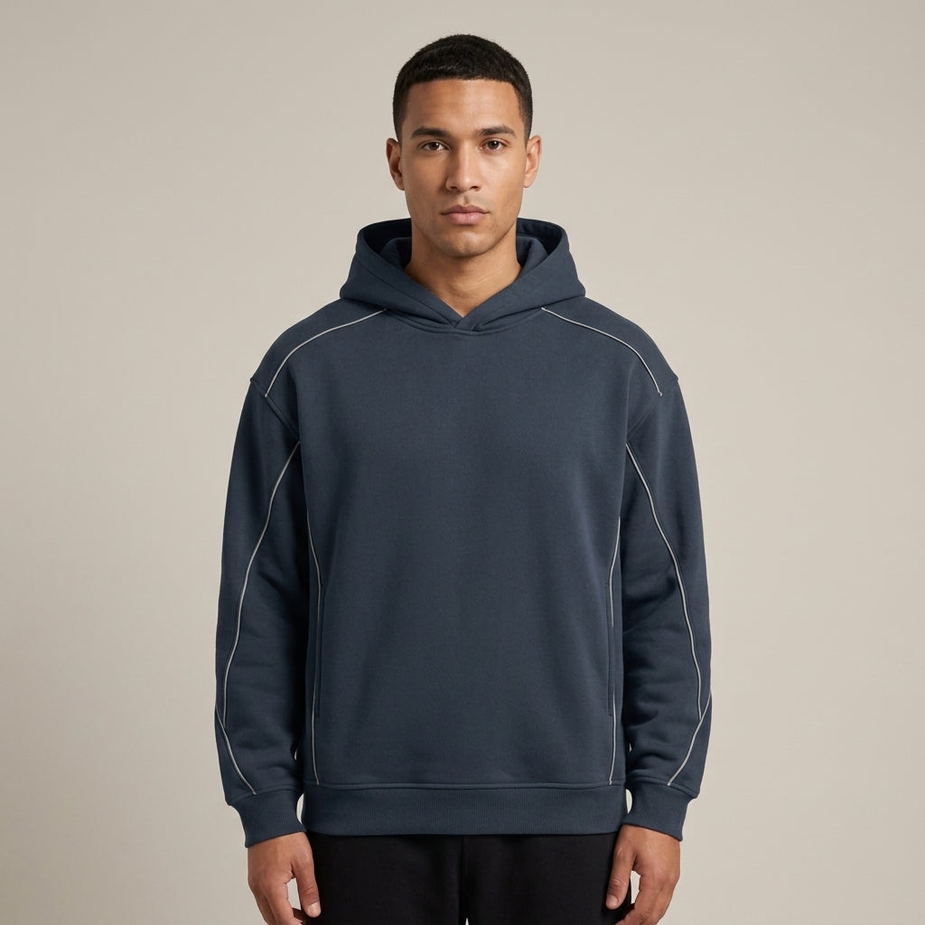 Navy oversized piping fleece hoodie, model in a straight front view.