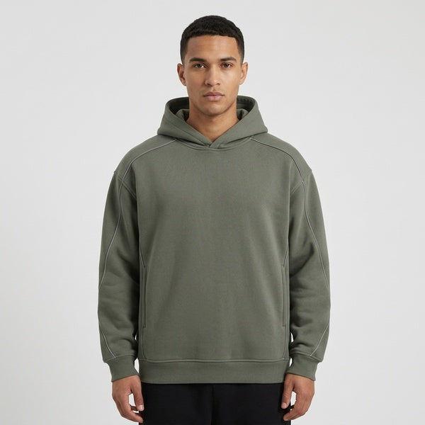 Muted gray-green oversized piping fleece hoodie, model in a straight front view.
