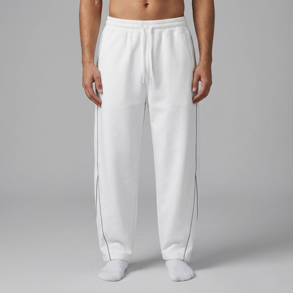 White piping fleece barrel-leg sweatpants, model in a straight front view.