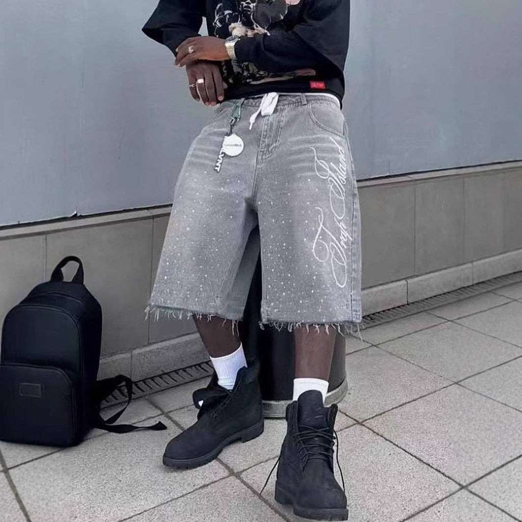 Vintage-wash denim shorts by Heavy Standard, long loose cut with a zip fly