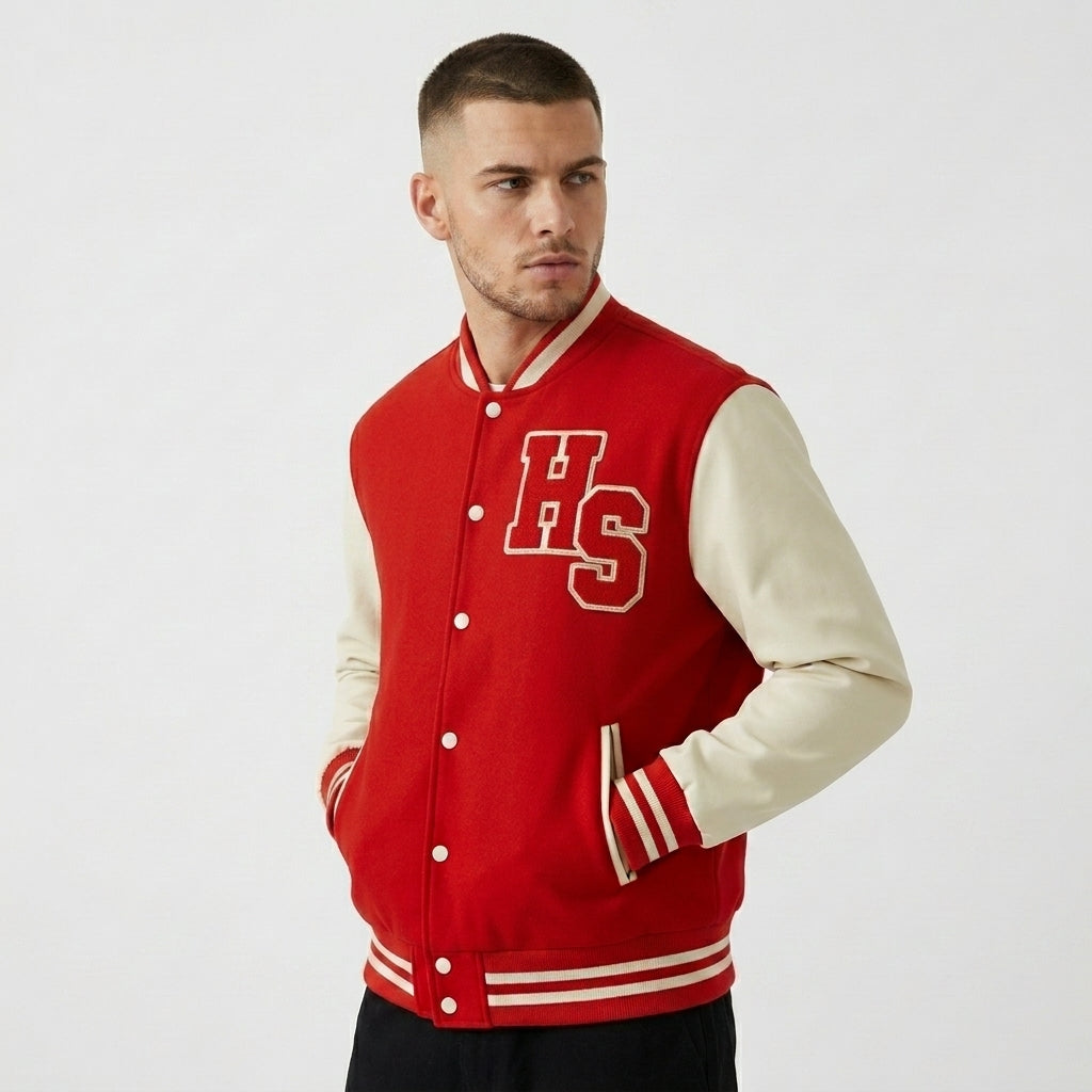 Red and cream Two-Tone Fleeced Varsity Jacket with HS chest lettering, worn in a three-quarter front view.