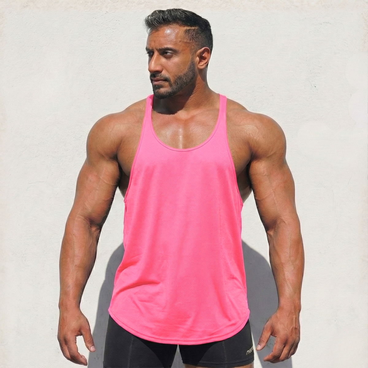 Neon pink Stringer Tank Top, model in a front view.