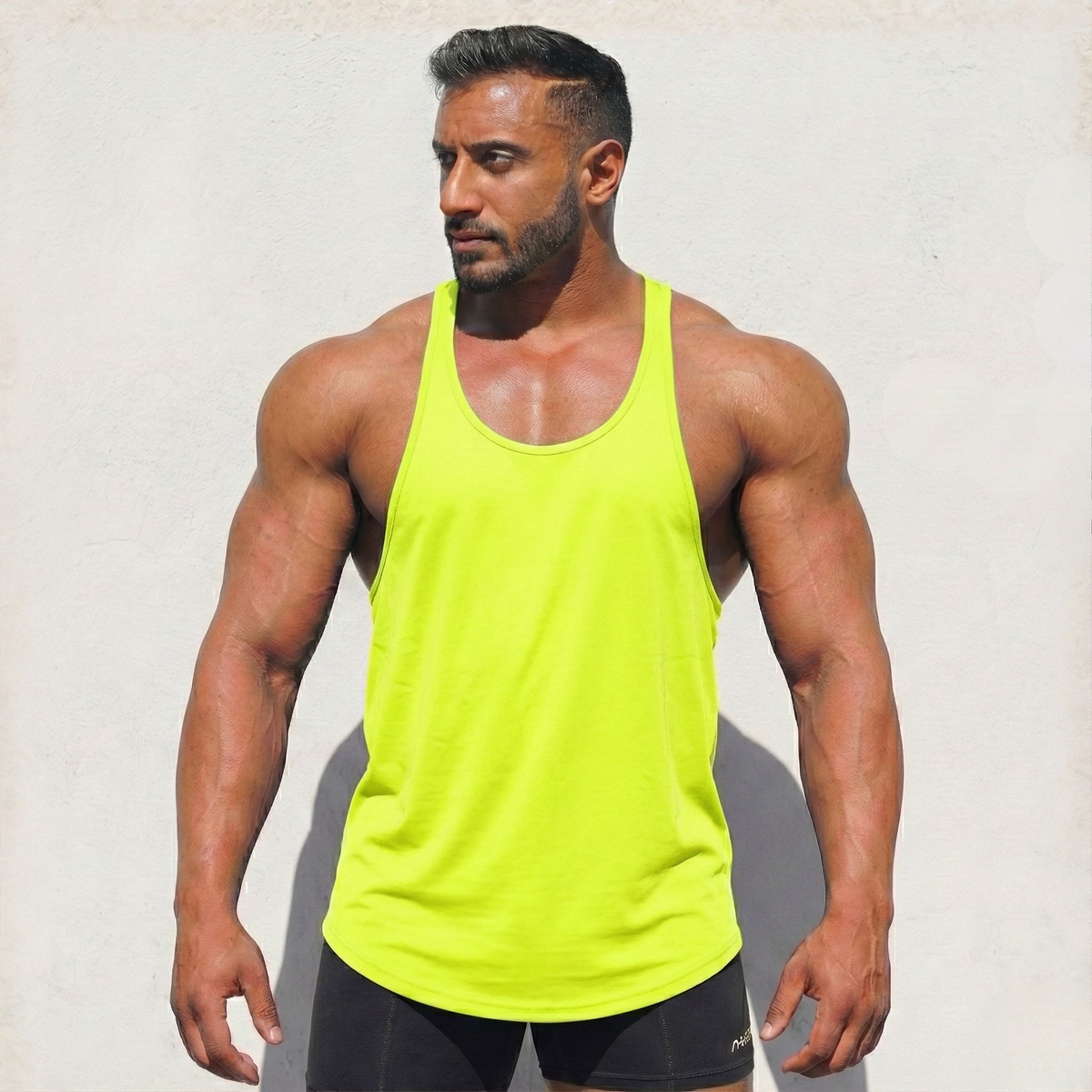 Neon yellow Stringer Tank Top, model in a front view.