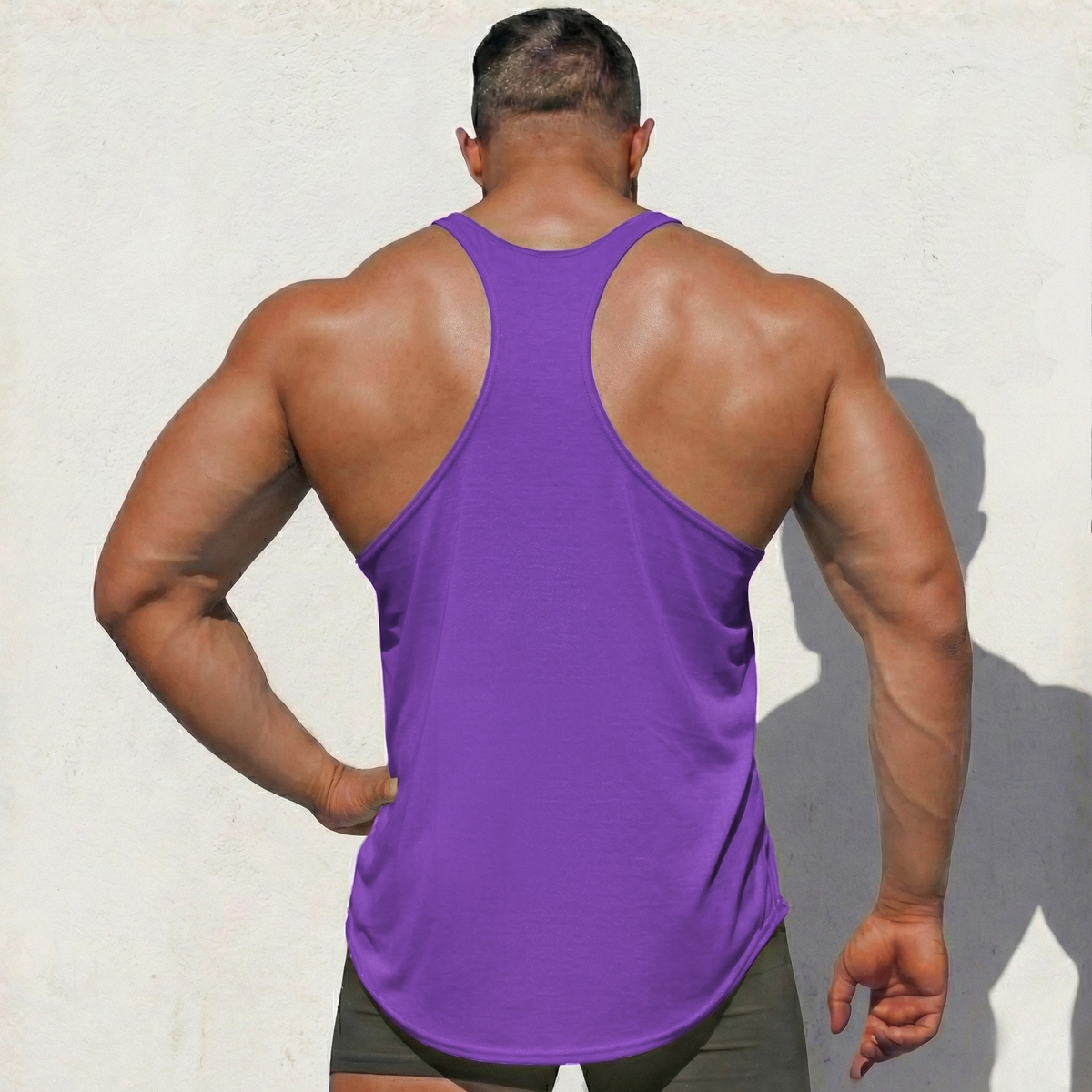 Purple Stringer Tank Top, model in a back view, showing the racerback cut.