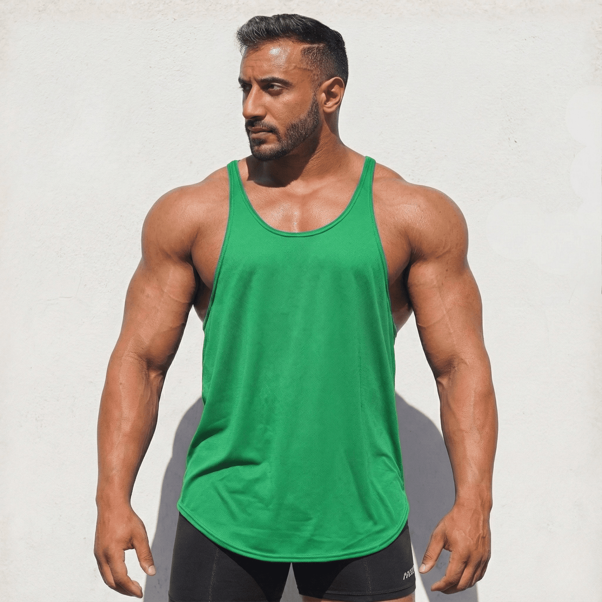 Green Stringer Tank Top, model in a front view.