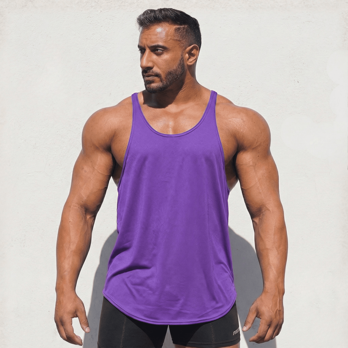 Purple Stringer Tank Top, model in a front view.