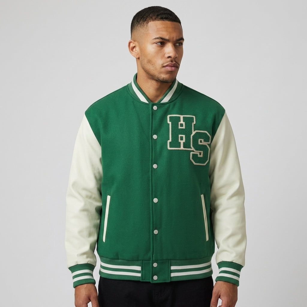 Green and cream Two-Tone Fleeced Varsity Jacket on a model, showing the snap front and striped ribbing.