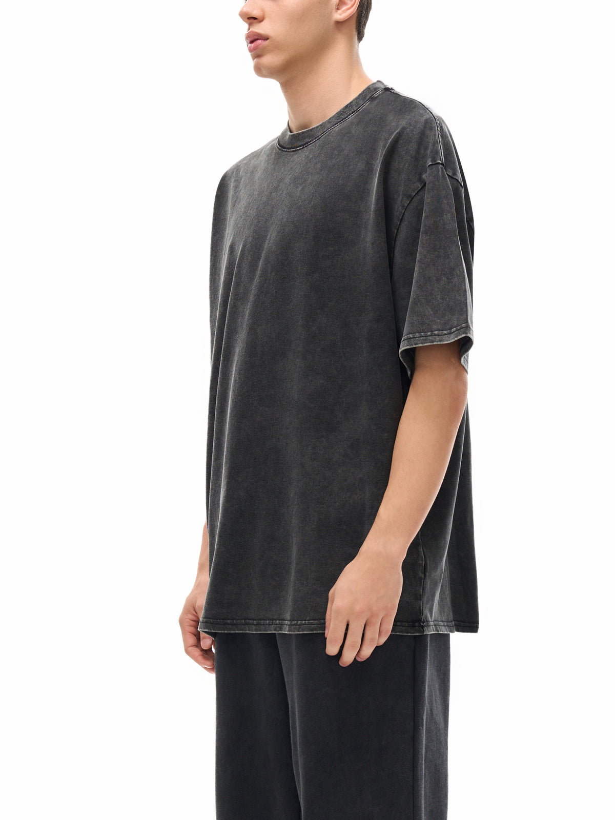 Batik black heavyweight washed T-shirt on model, side profile