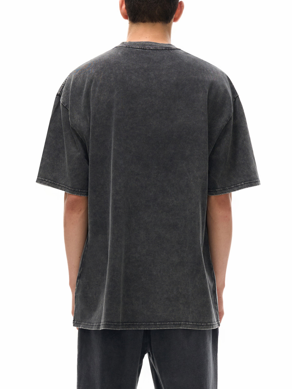 Batik black heavyweight washed T-shirt on model, back view